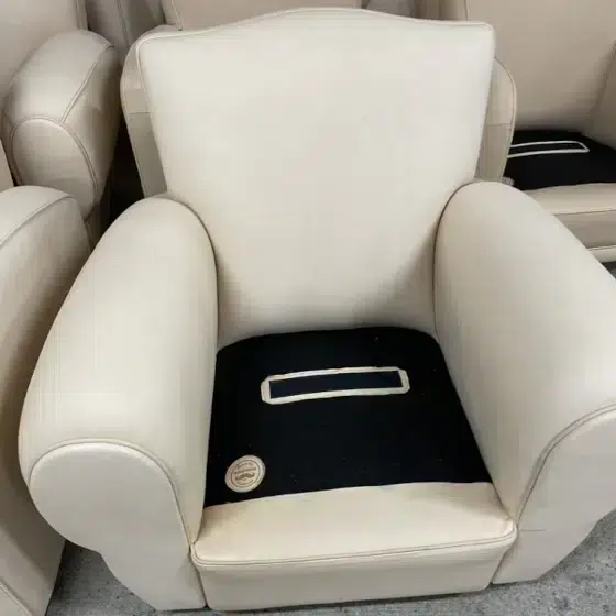 Club armchair in non-dyed leather