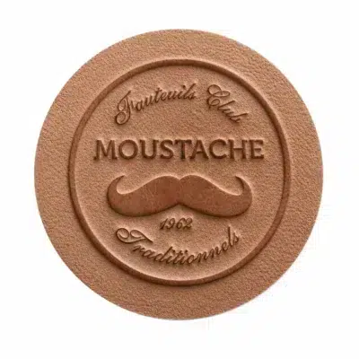 Moustache 1962 logo embossed on the leather of a handcrafted Club Chair